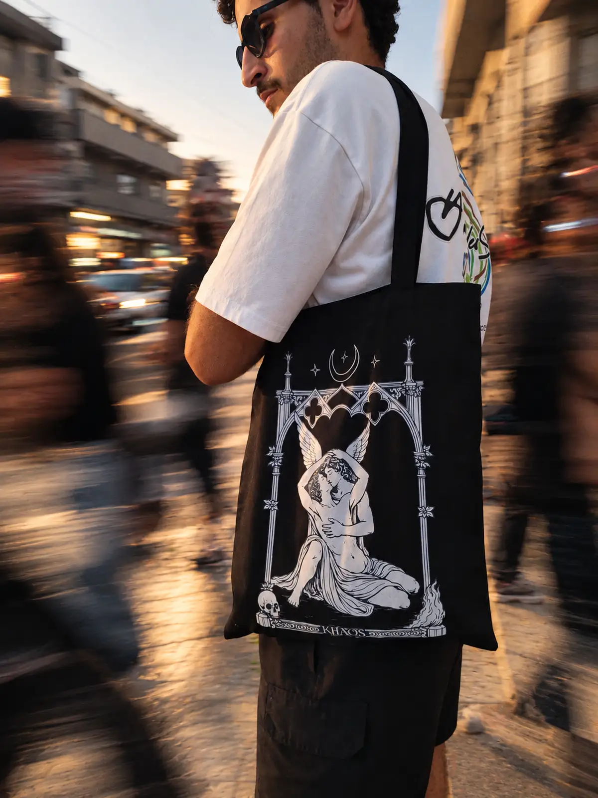 KHAOS model carrying the Psyche artwork tote in Beirut